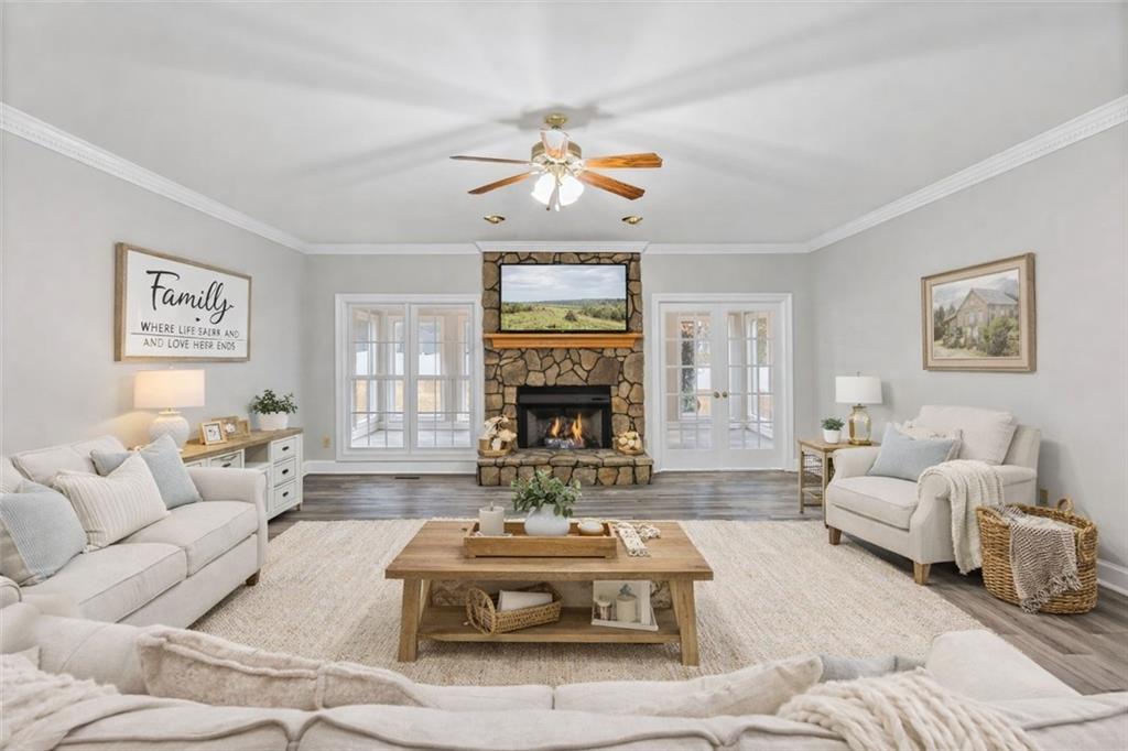 4003 Garden Lakes Parkway Rome, GA 30165 - Photo 7 of 20 a living room with furniture a fireplace and a large window
