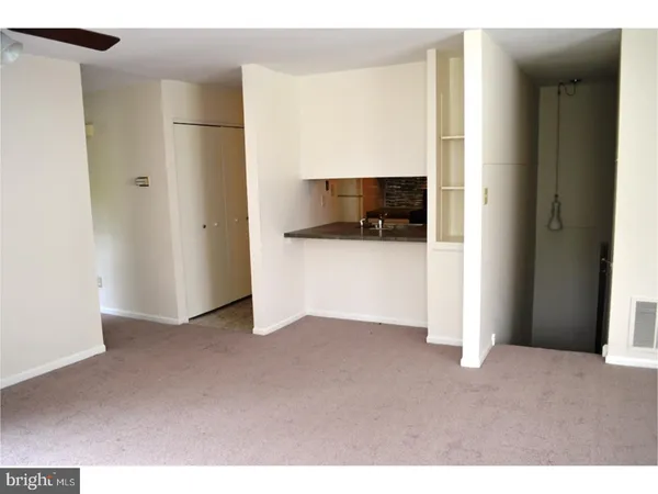 a view of kitchen and hallway