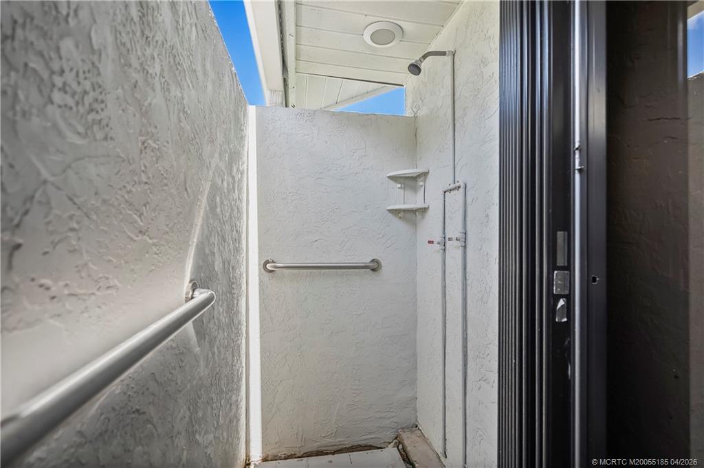 4620 Southeast Quail Trail Stuart, FL 34997 - Photo 37 of 71 a bathroom with a shower and a glass door