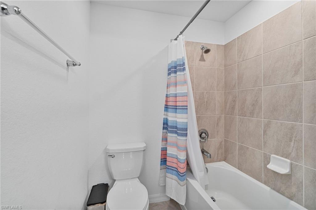 2118 Hamlin Street Naples, FL 34120 - Photo 18 of 41 a bathroom with a toilet and shower