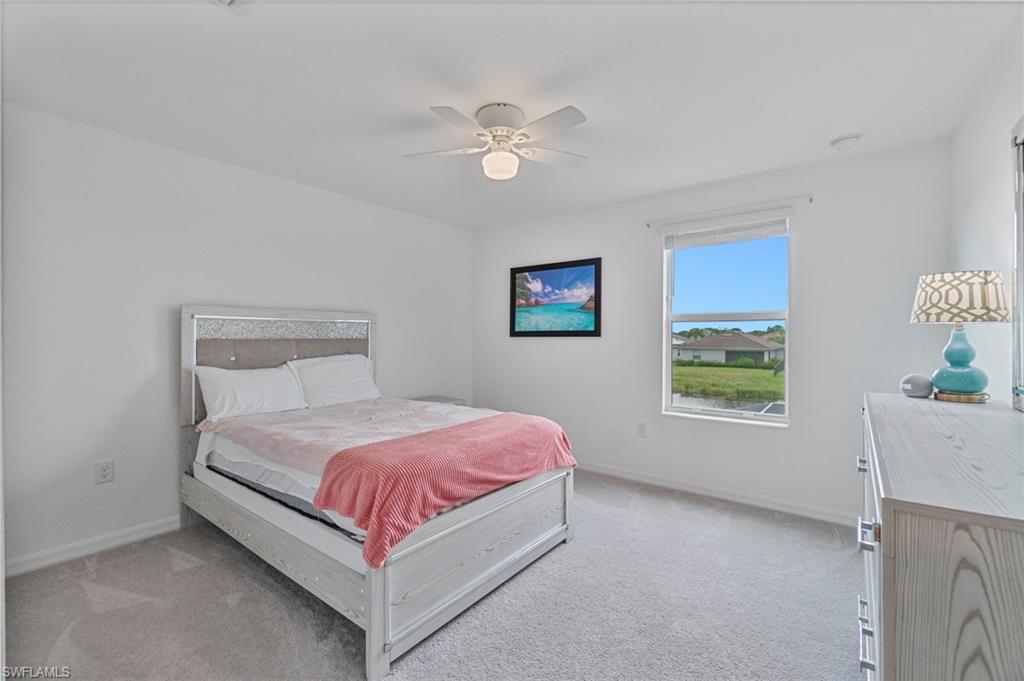 2118 Hamlin Street Naples, FL 34120 - Photo 20 of 41 a bedroom with a bed and window