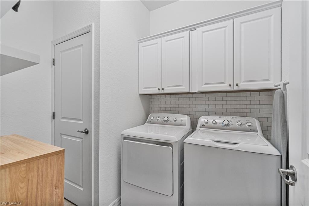 2118 Hamlin Street Naples, FL 34120 - Photo 21 of 41 a utility room with dryer and washer