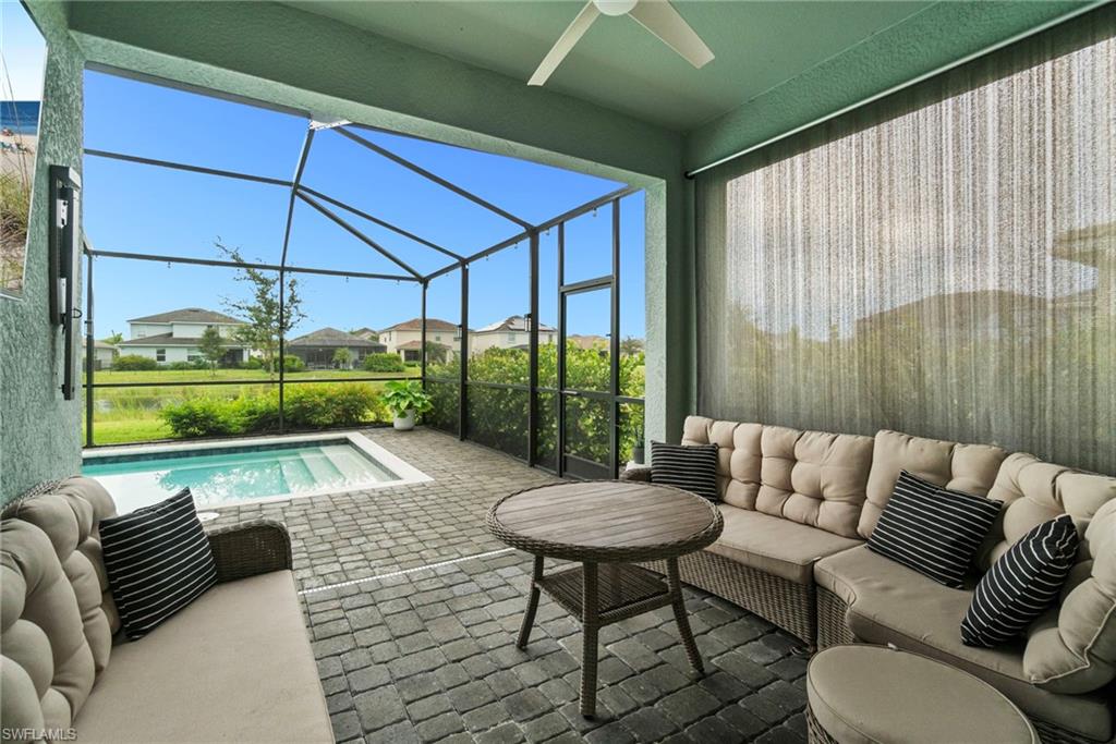 2118 Hamlin Street Naples, FL 34120 - Photo 22 of 41 a balcony with furniture and a garden