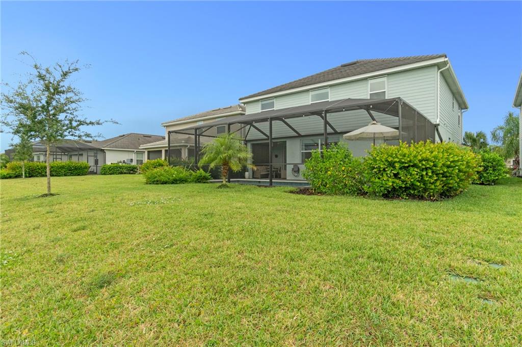 2118 Hamlin Street Naples, FL 34120 - Photo 28 of 41 a front view of house with yard