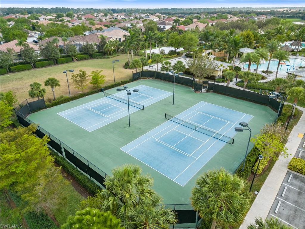 2118 Hamlin Street Naples, FL 34120 - Photo 32 of 41 an aerial view of a house with a lake view