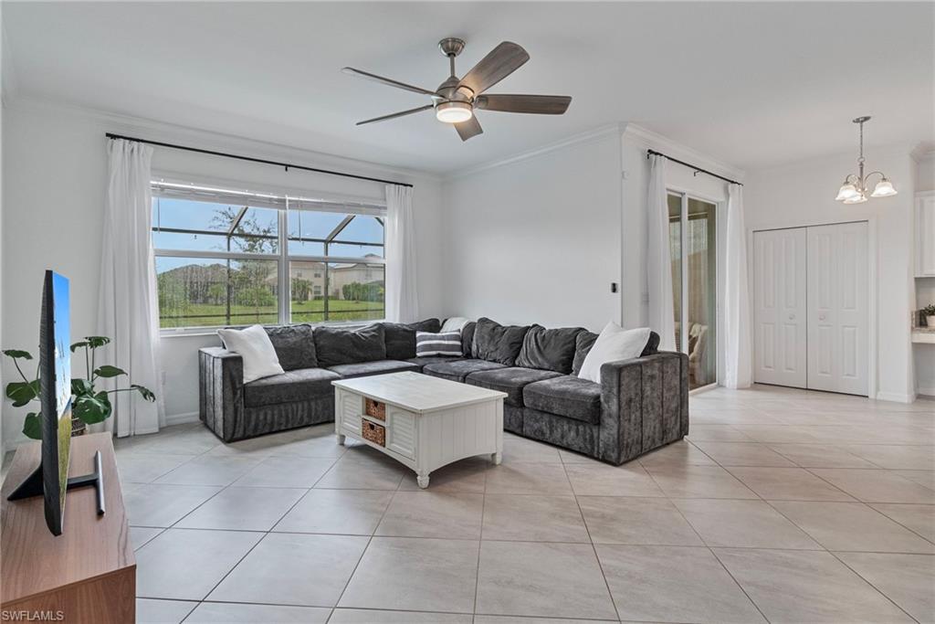 2118 Hamlin Street Naples, FL 34120 - Photo 4 of 41 a living room with furniture and a large window