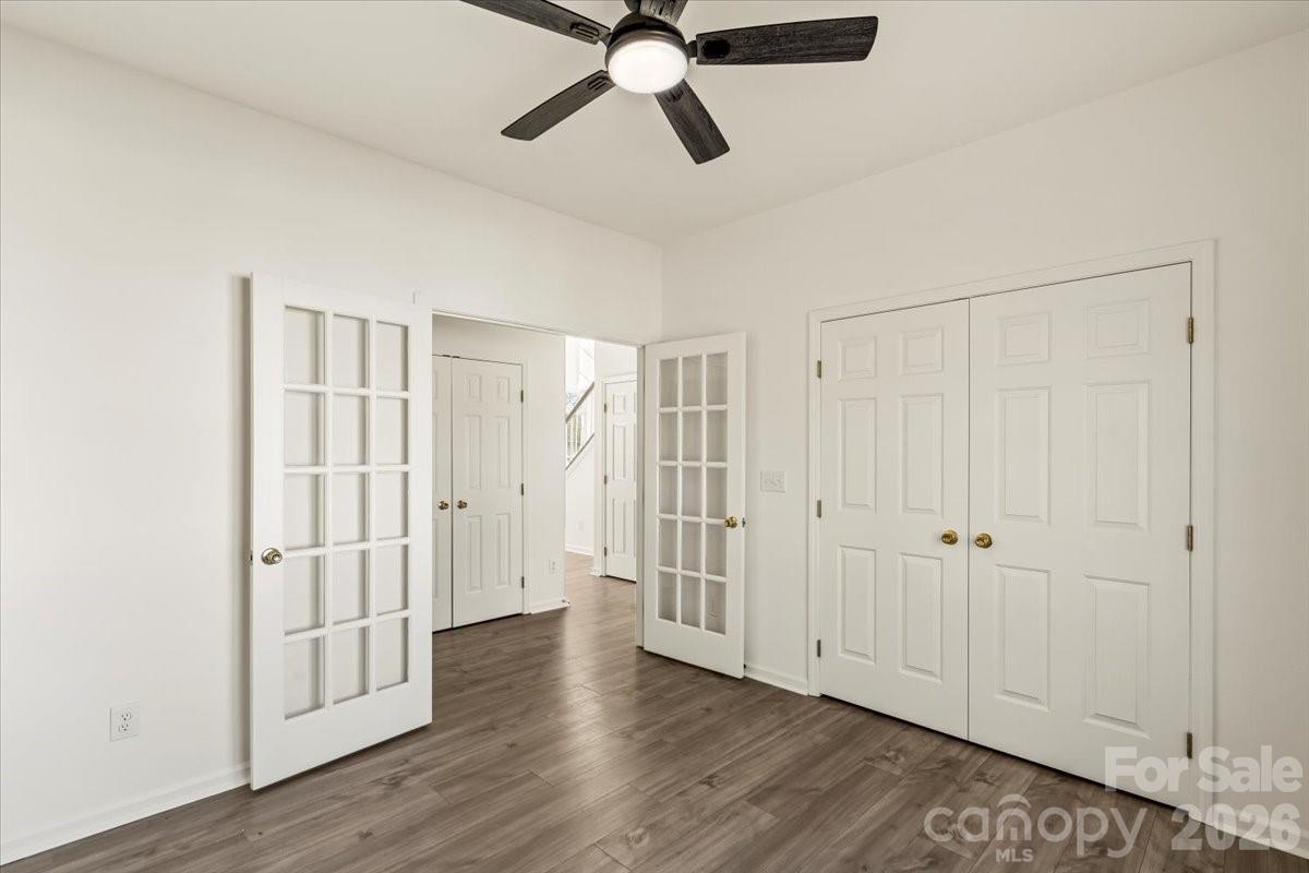 7215 Conifer Circle Indian Trail, NC 28079 - Photo 14 of 34 a view of an empty room with wooden floor