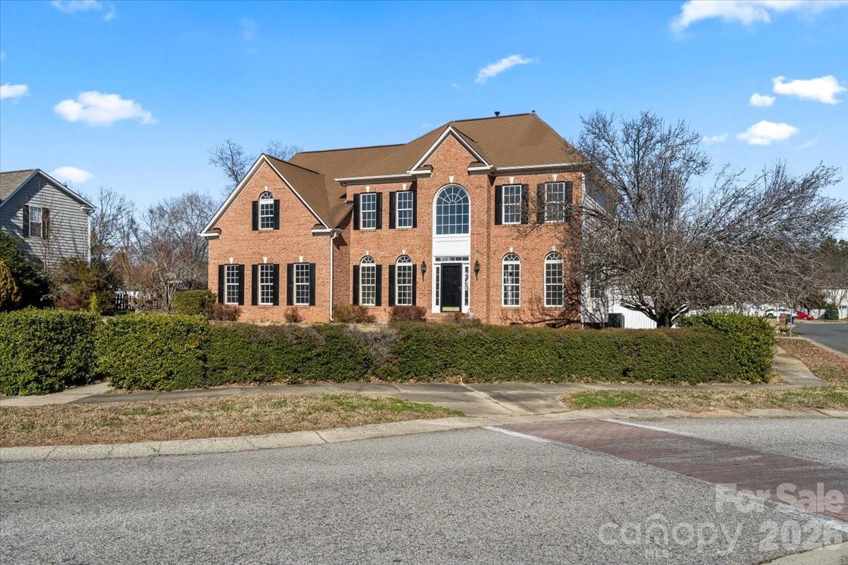 7215 Conifer Circle Indian Trail, NC 28079 - Photo 2 of 34 a front view of a house with a yard