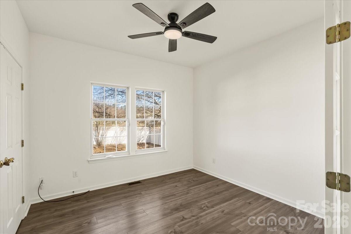 7215 Conifer Circle Indian Trail, NC 28079 - Photo 29 of 34 wooden floor in an empty room with a window