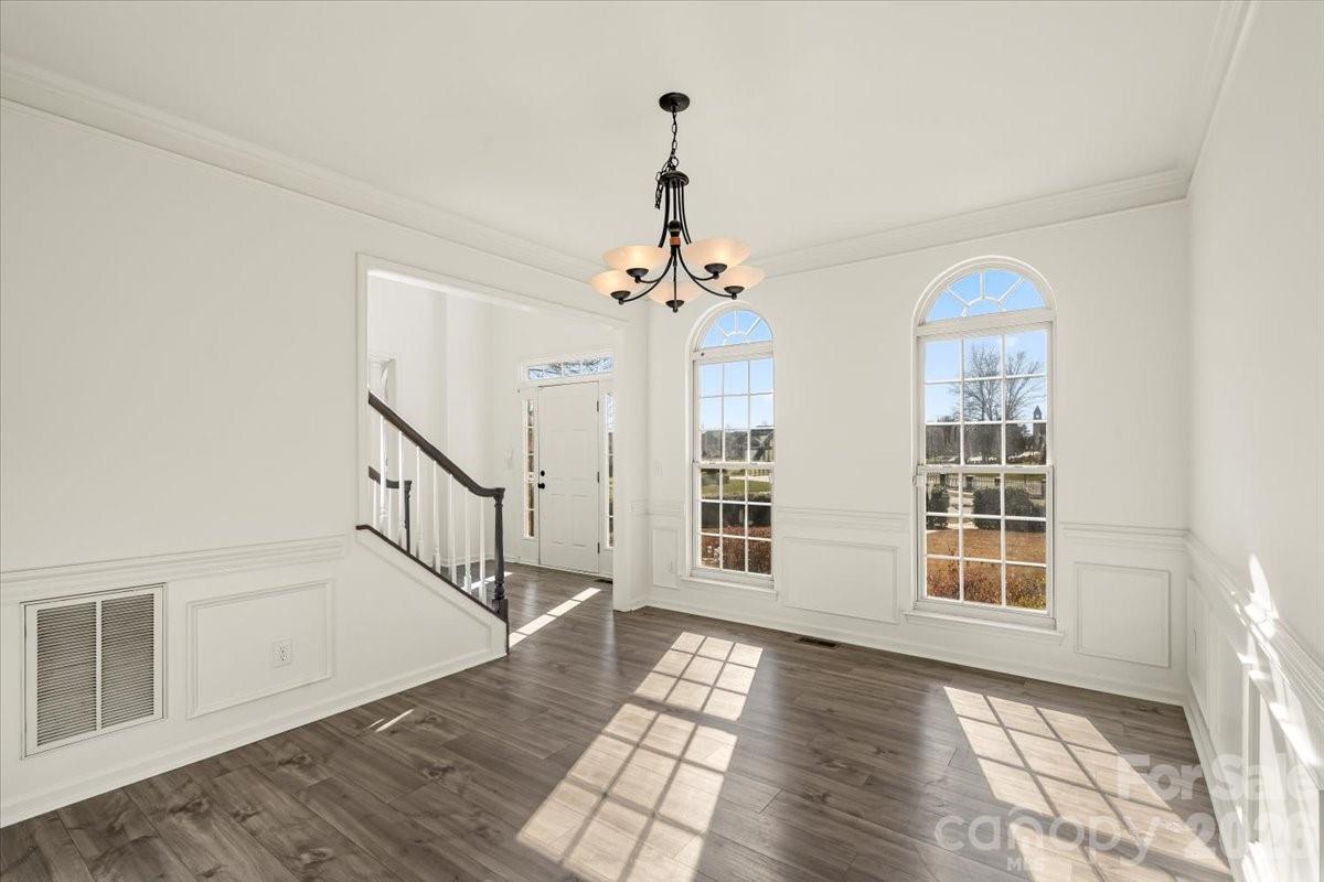 7215 Conifer Circle Indian Trail, NC 28079 - Photo 4 of 34 wooden floor in an empty room with a window