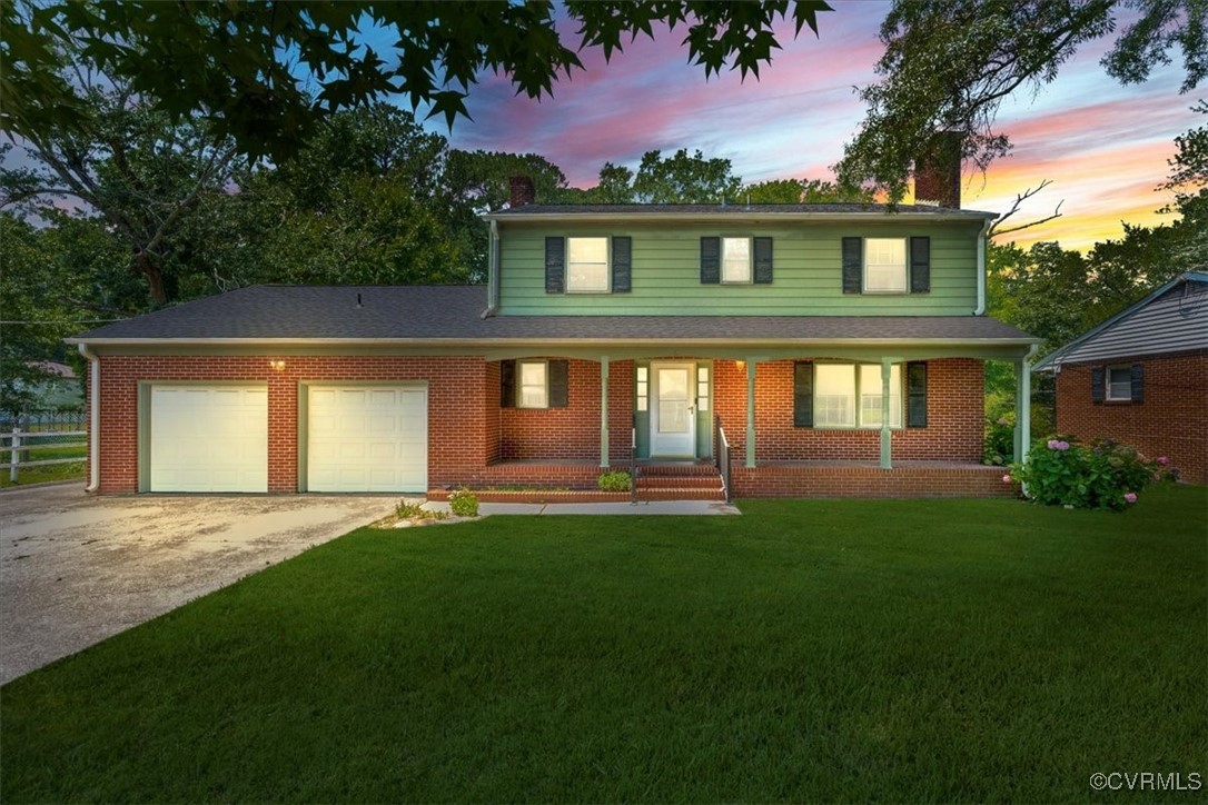 Traditional-style home with a chimney, concrete dr