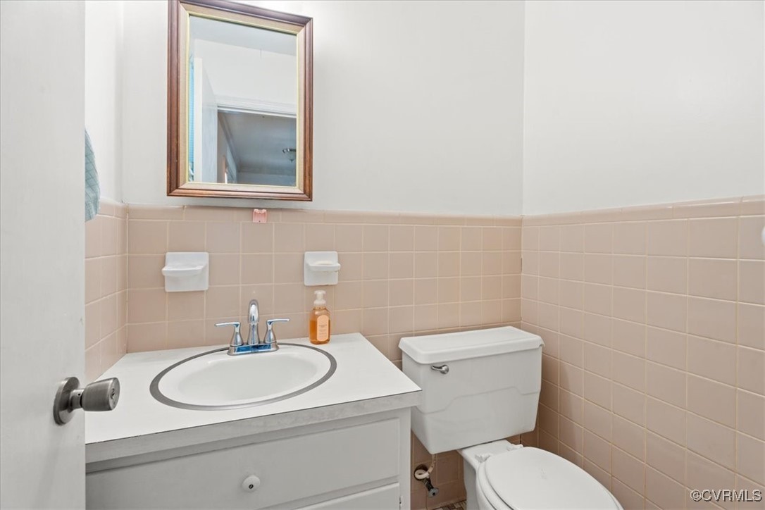 43 Franktown Road Hampton, VA 23663 - Photo 22 of 47 Half bathroom with vanity, tile walls, and a wains
