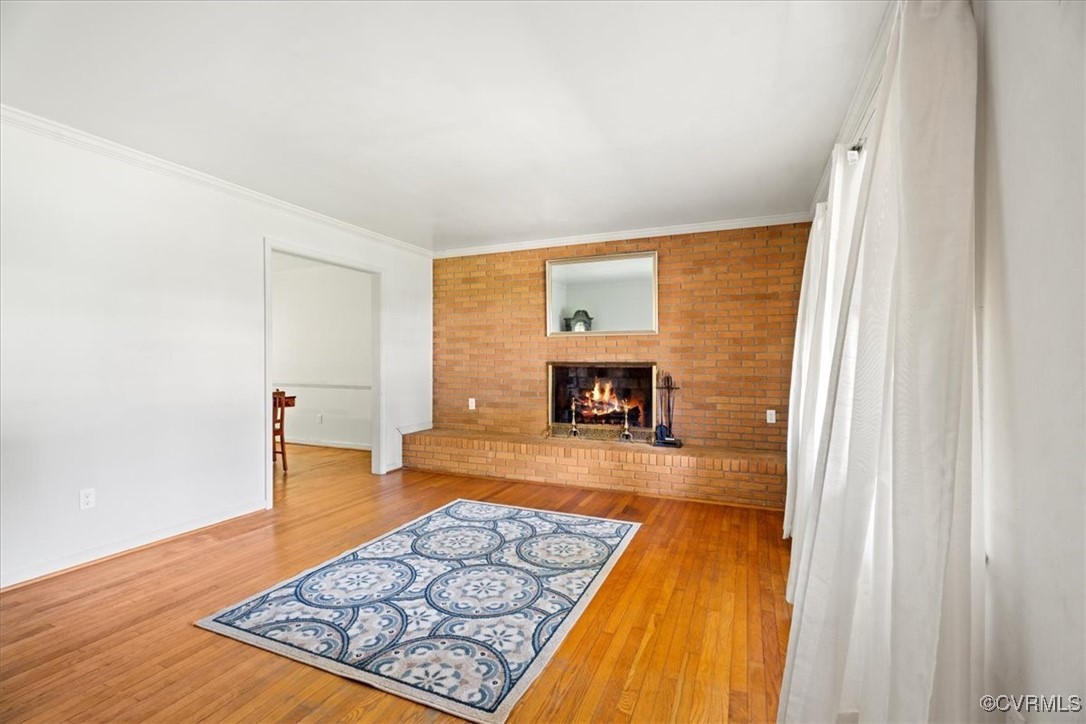 43 Franktown Road Hampton, VA 23663 - Photo 23 of 47 Unfurnished living room with a fireplace, hardwood