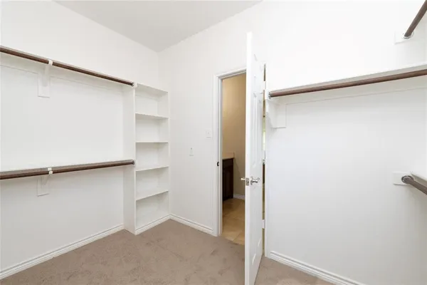 a view of an empty walk in closet