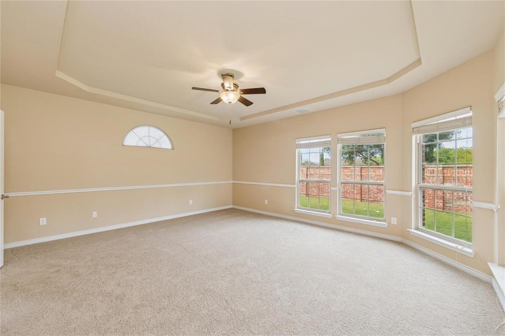 425 Windward Drive Murphy, TX 75094 - Photo 18 of 31 an empty room with a empty space and a ceiling fan