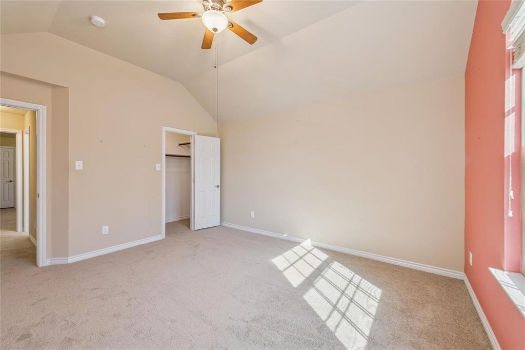 425 Windward Drive Murphy, TX 75094 - Photo 19 of 31 an empty room with a ceiling fan and a window