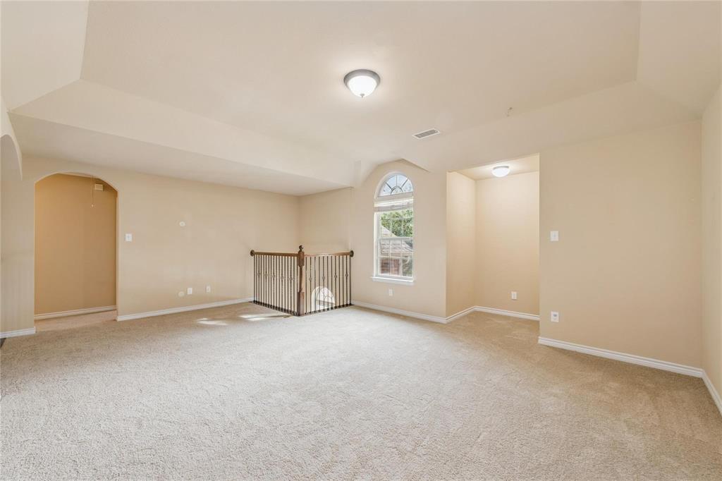 425 Windward Drive Murphy, TX 75094 - Photo 22 of 31 an empty room with windows and mirror