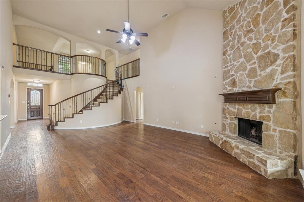 425 Windward Drive Murphy, TX 75094 - Photo 24 of 31 a view of an empty room with wooden floor fireplace and a window