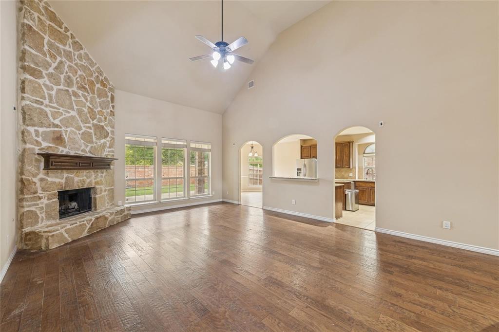 425 Windward Drive Murphy, TX 75094 - Photo 25 of 31 a view of empty room with wooden floor and fireplace