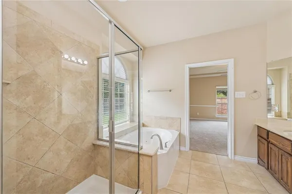 a bathroom with a shower and a sink