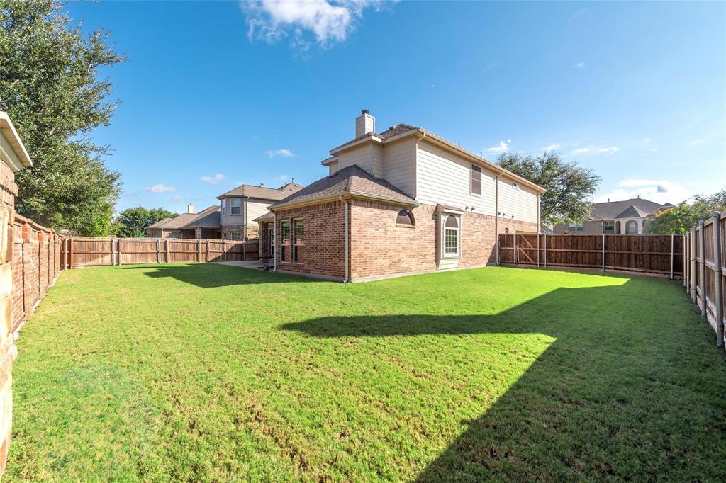 425 Windward Drive Murphy, TX 75094 - Photo 5 of 31 a view of a house with a yard