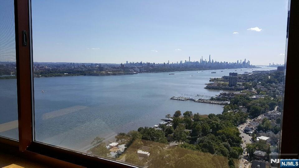 100 Old Palisade Road, Unit 1001 Fort Lee, NJ 07024 - Photo 2 of 3 a view of a lake from a balcony