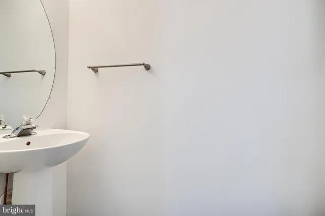 a bathroom with a sink and mirror