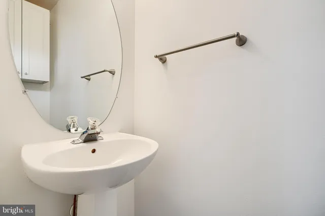 a white sink sitting next to a white sink
