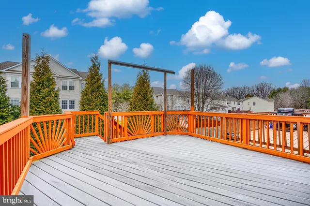 a view of balcony with wooden floor and seating space