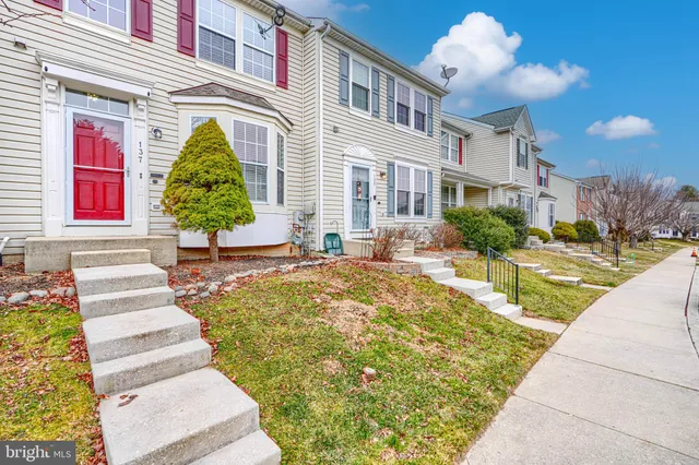 a front view of a house with a swimming pool
