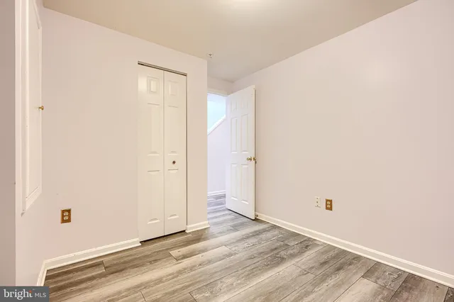 a front view of a residential apartment building with a yard