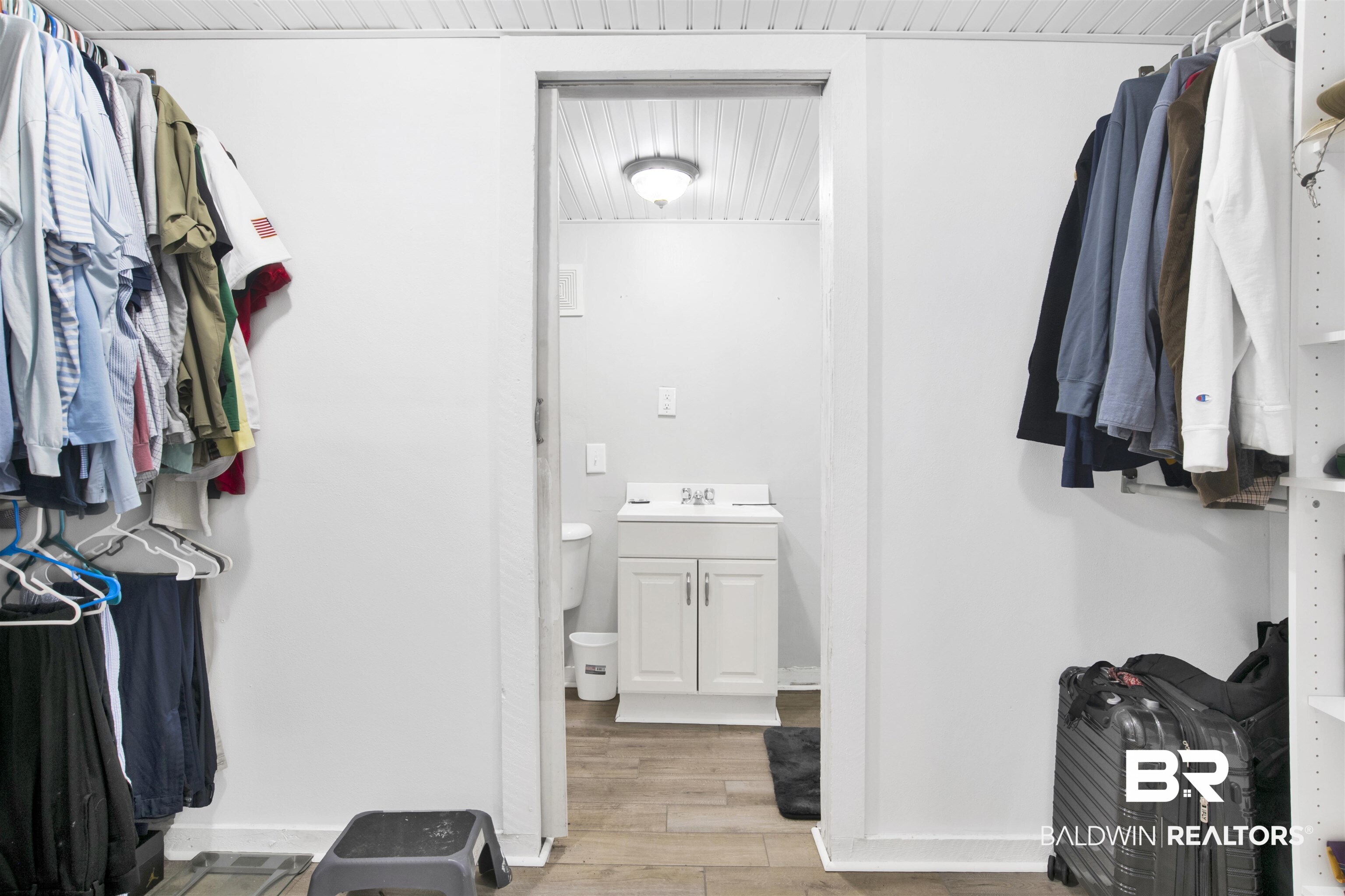 10244 Magnolia Road Irvington, AL 36544 - Photo 19 of 37 Walk in closet with a sink and light wood-type flooring