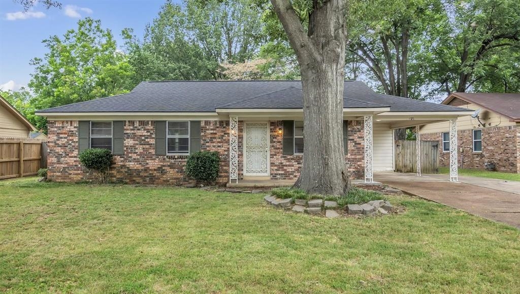 front view of a house with a yard