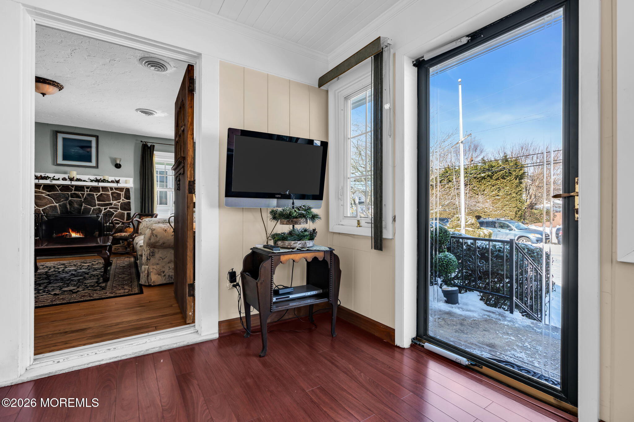 712 McLean Avenue Point Pleasant Beach, NJ 08742 - Photo 15 of 48 a view of a livingroom with wooden floor and a flat screen tv