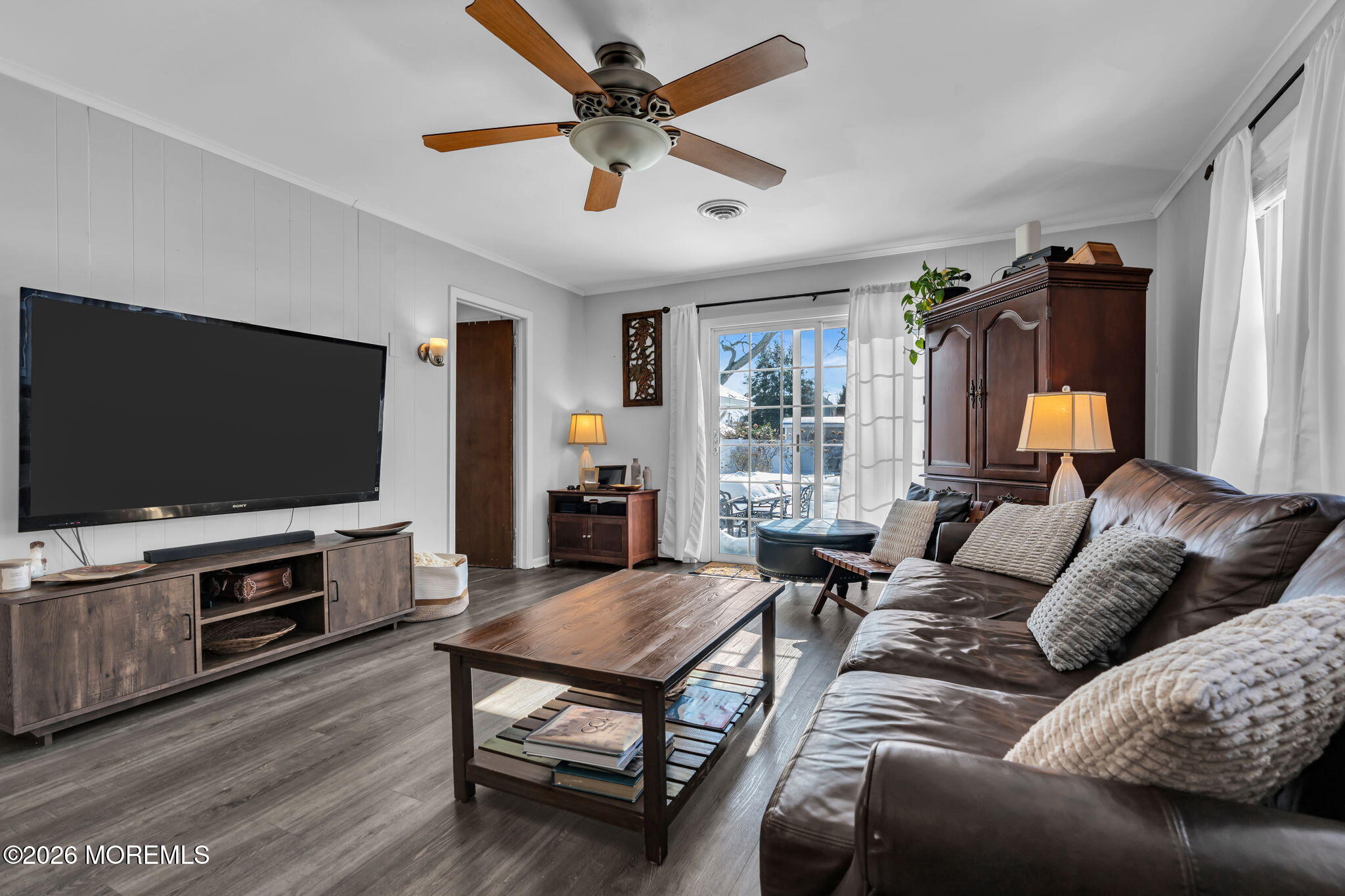 712 McLean Avenue Point Pleasant Beach, NJ 08742 - Photo 2 of 48 a living room with furniture and a flat screen tv