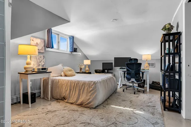 a balcony with furniture and a potted plant