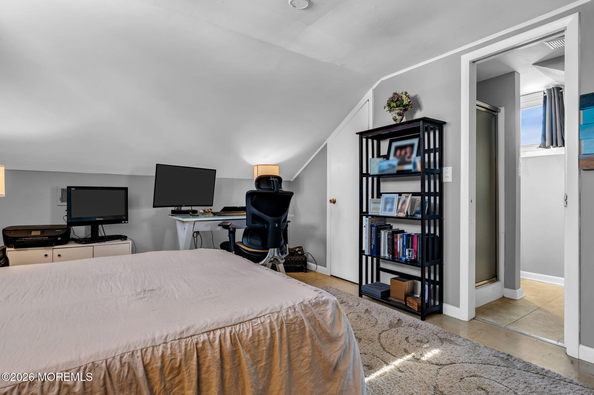 712 McLean Avenue Point Pleasant Beach, NJ 08742 - Photo 42 of 48 a bedroom with a bed a book shelf and a window