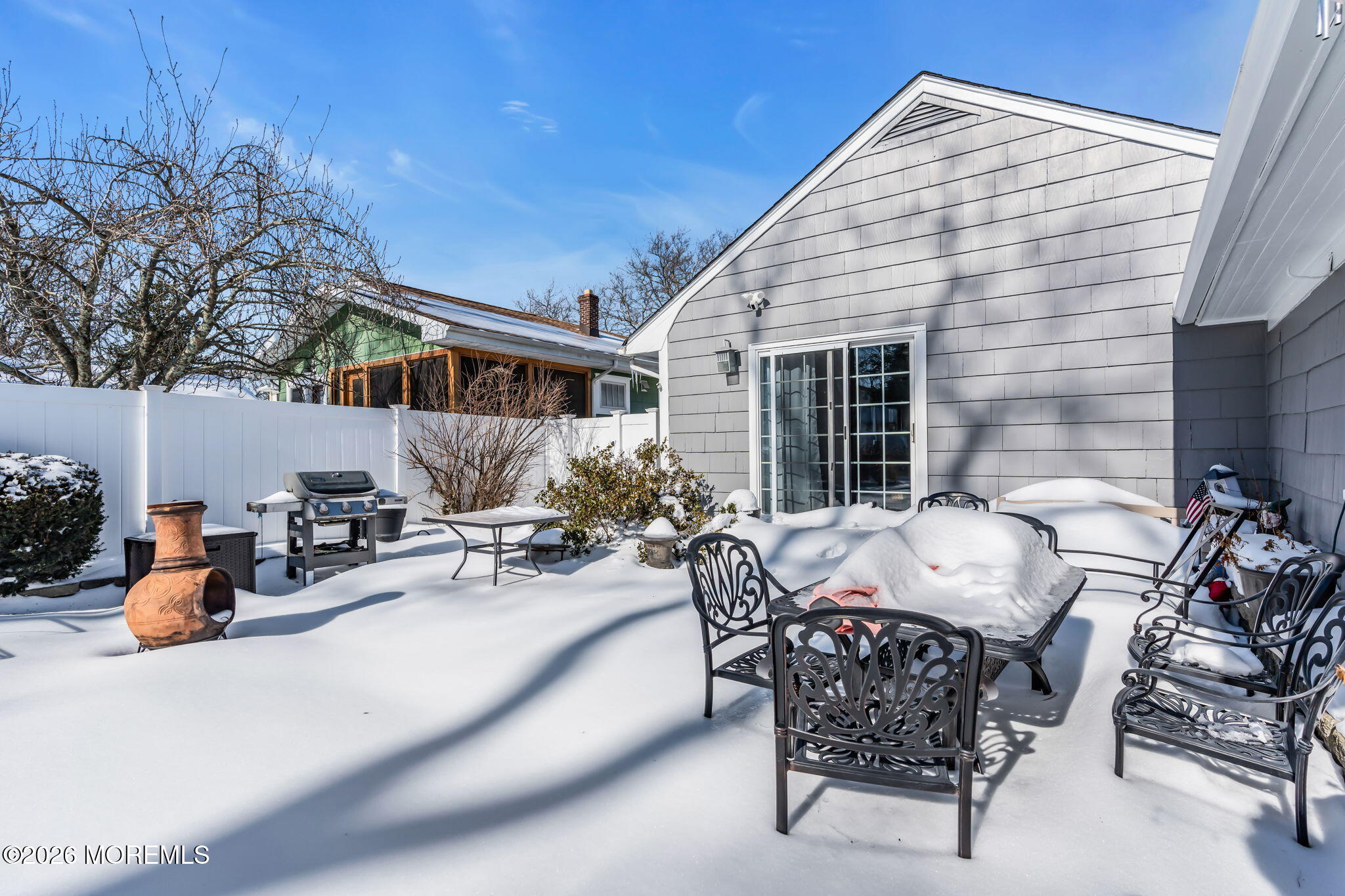 712 McLean Avenue Point Pleasant Beach, NJ 08742 - Photo 48 of 48 a view of a patio with table and chairs and potted plants