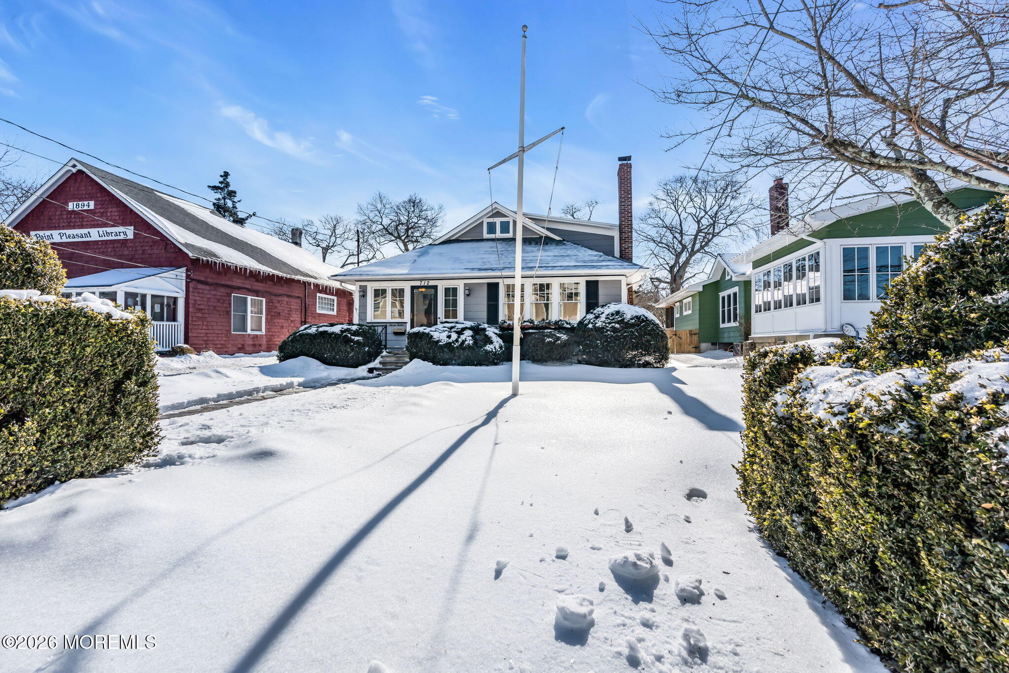 712 McLean Avenue Point Pleasant Beach, NJ 08742 - Photo 10 of 48 a view of a house with a yard covered in snow