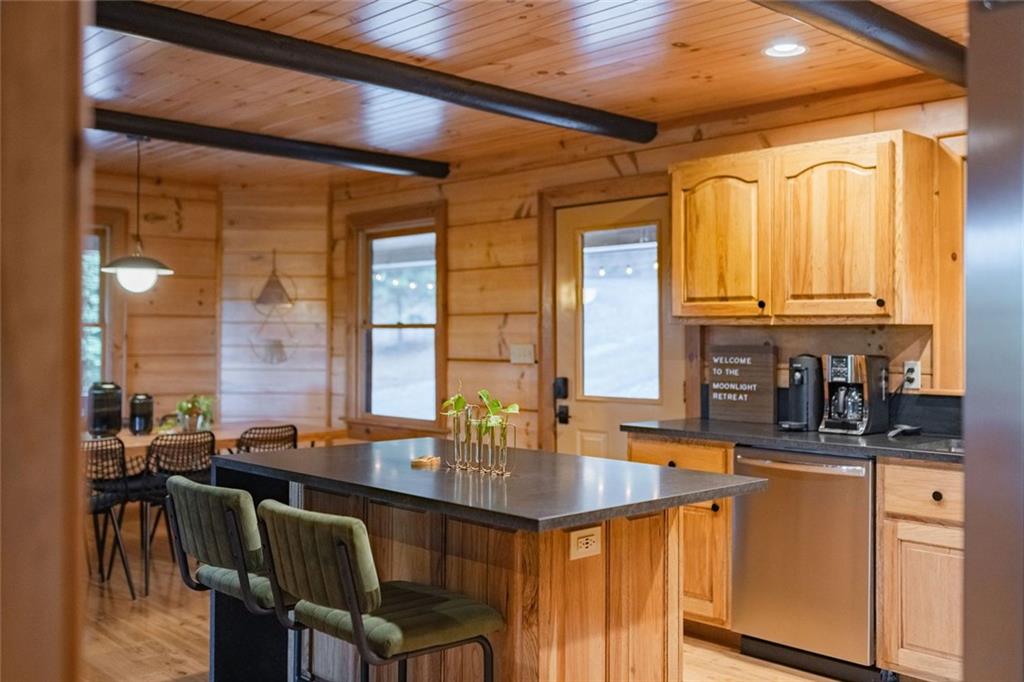 140 Black Oaks Road Cherry Log, GA 30522 - Photo 11 of 85 a kitchen with a window a sink and dining table chair