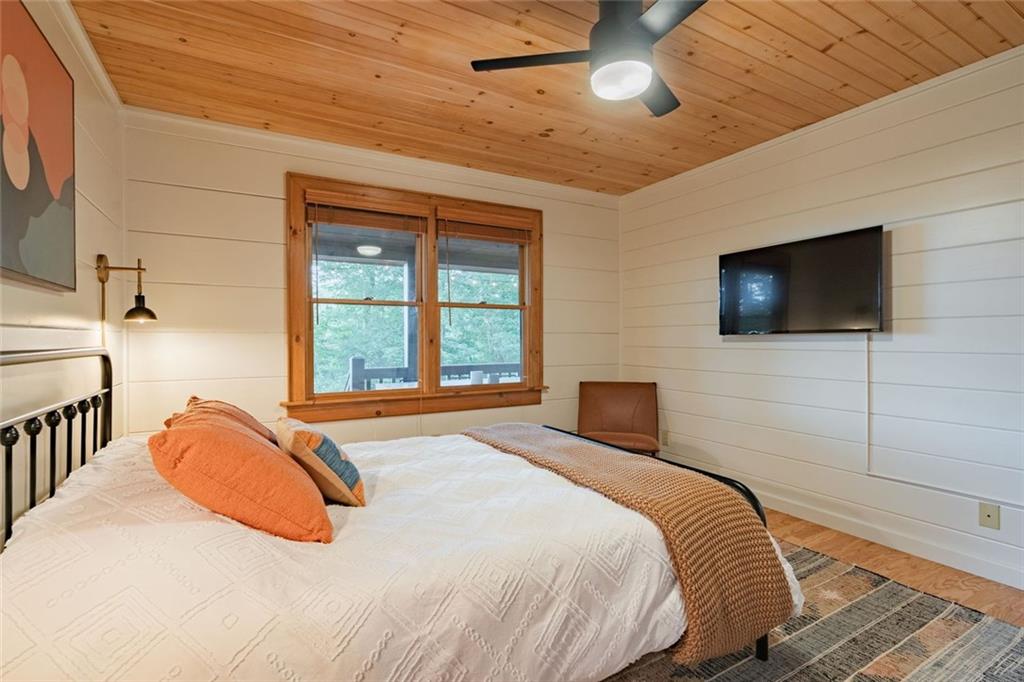 140 Black Oaks Road Cherry Log, GA 30522 - Photo 13 of 85 a bedroom with a bed and a flat screen tv