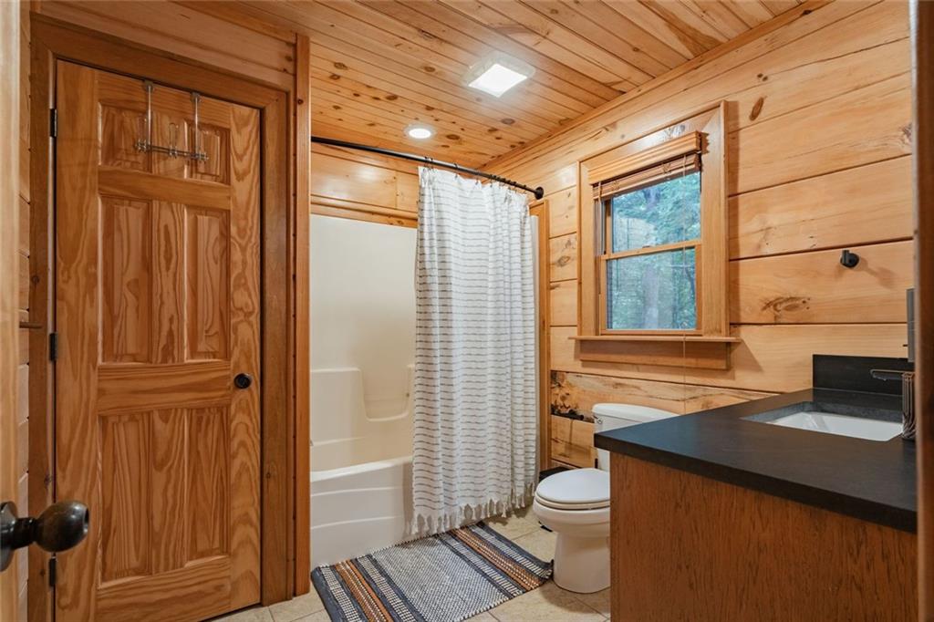 140 Black Oaks Road Cherry Log, GA 30522 - Photo 17 of 85 a bathroom with a granite countertop sink toilet and shower