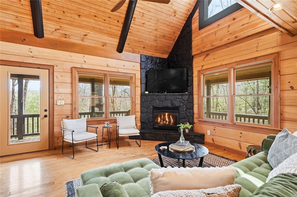 140 Black Oaks Road Cherry Log, GA 30522 - Photo 2 of 85 a living room with furniture fireplace and a large window