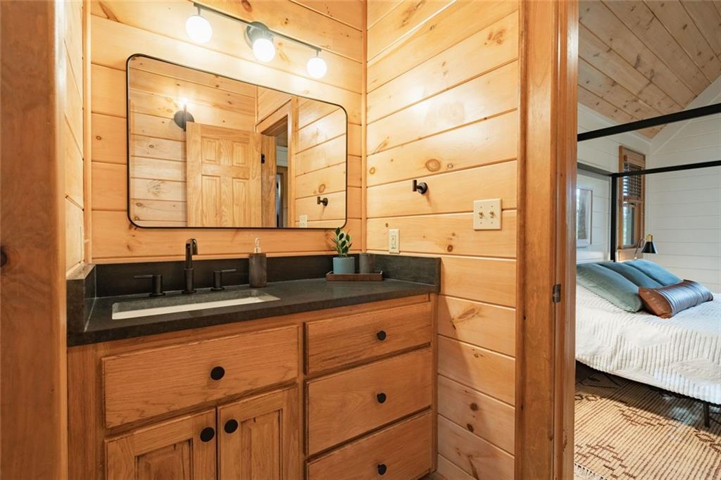 140 Black Oaks Road Cherry Log, GA 30522 - Photo 24 of 85 a bathroom with a sink and a mirror