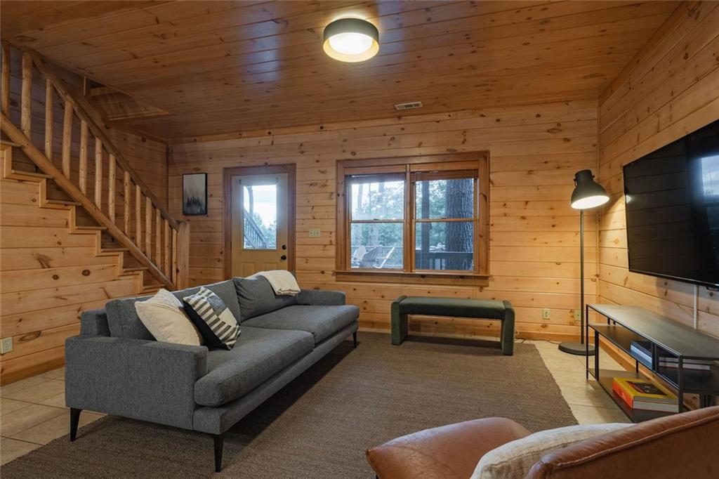 140 Black Oaks Road Cherry Log, GA 30522 - Photo 33 of 85 a living room with furniture and a flat screen tv