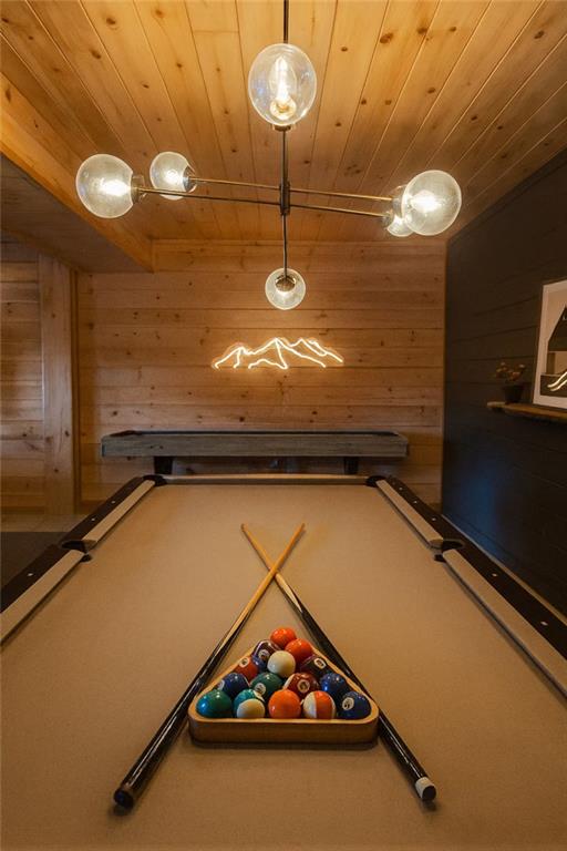 140 Black Oaks Road Cherry Log, GA 30522 - Photo 37 of 85 a room with pool table and a chandelier