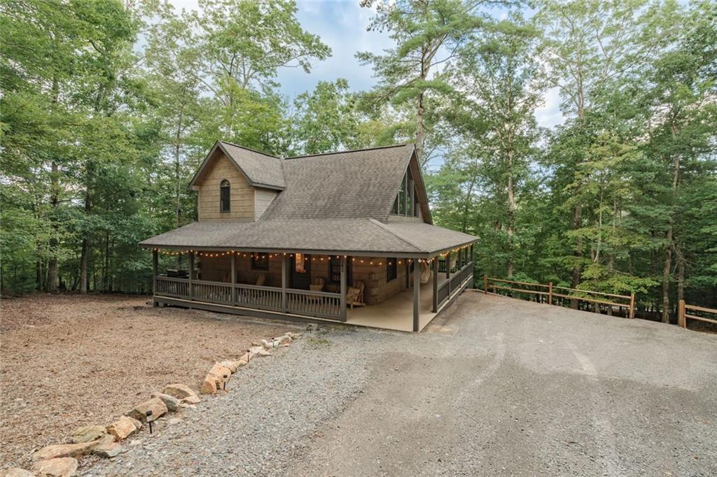 140 Black Oaks Road Cherry Log, GA 30522 - Photo 43 of 85 a view of a house with a yard plants and large tree