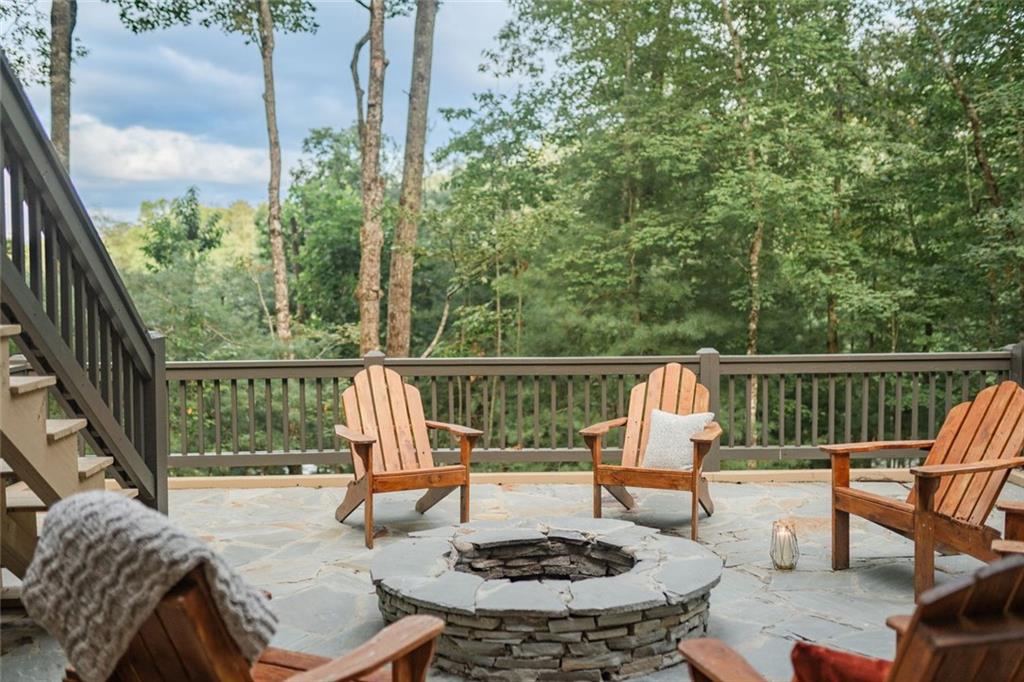 140 Black Oaks Road Cherry Log, GA 30522 - Photo 64 of 85 a view of a deck with couches table and chairs