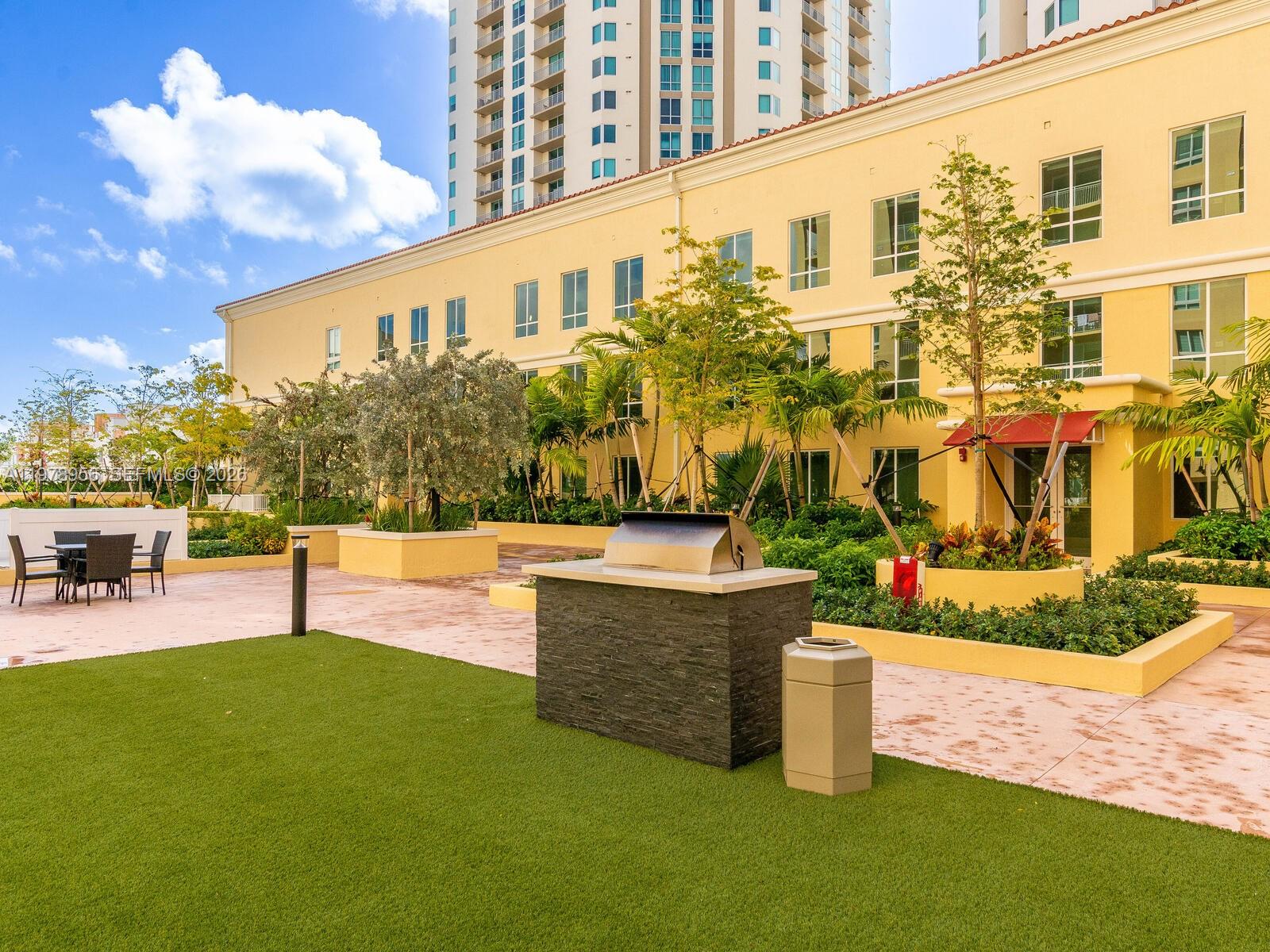 7350 Southwest 89th Street, Unit 719S Miami, FL 33156 - Photo 30 of 30 a view of a swimming pool with a bench and some trees