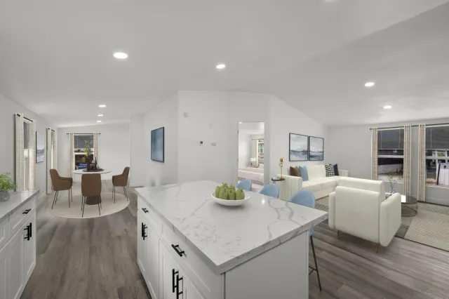 a view of kitchen island dining room living room with granite countertop furniture